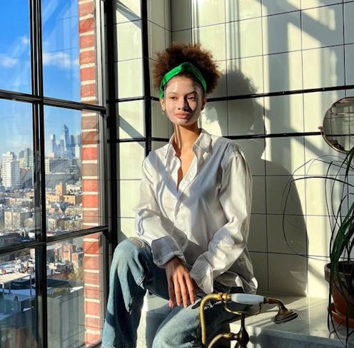 Tata Harper model with face mark sitting by window