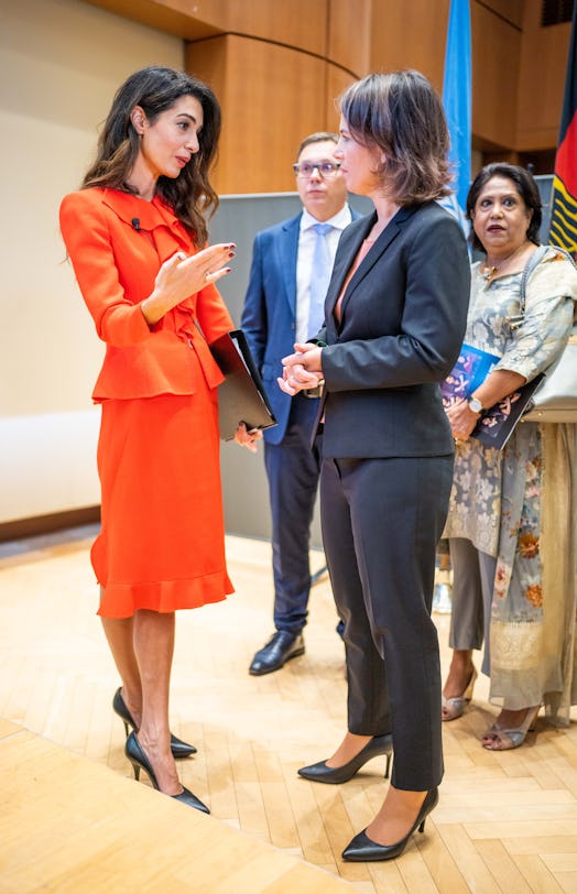 Amal Clooney chatting with German Foreign Minister Annalena Baerbock