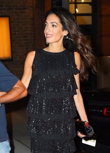 Amal Clooney wearing a black flapper-style minidress