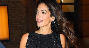 Amal Clooney wearing a black flapper-style minidress