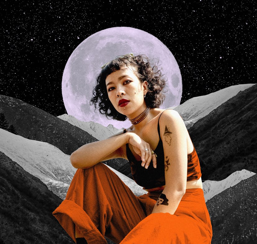 Young woman in front of a moon to show your October 2022 horoscope.
