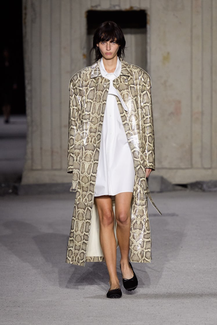 A model wearing a coat with a snakeskin design from Tod’s spring 2023