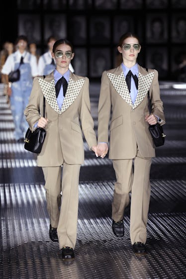 Gucci's Spring 2023 Runway Program Takes Twinning to a New Level 3 Models walk the runway of the Gucci Twinsburg Show during Milan Fashion Week Spring/Summer 2023 on S...