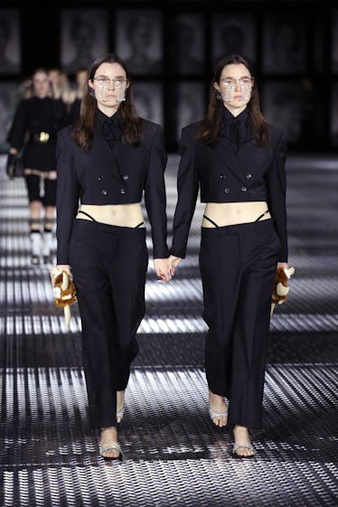 Gucci's Spring 2023 Runway Program Takes Twinning to a New Level 11 Models walk the runway of the Gucci Twinsburg Show during Milan Fashion Week Spring/Summer 2023 on S...