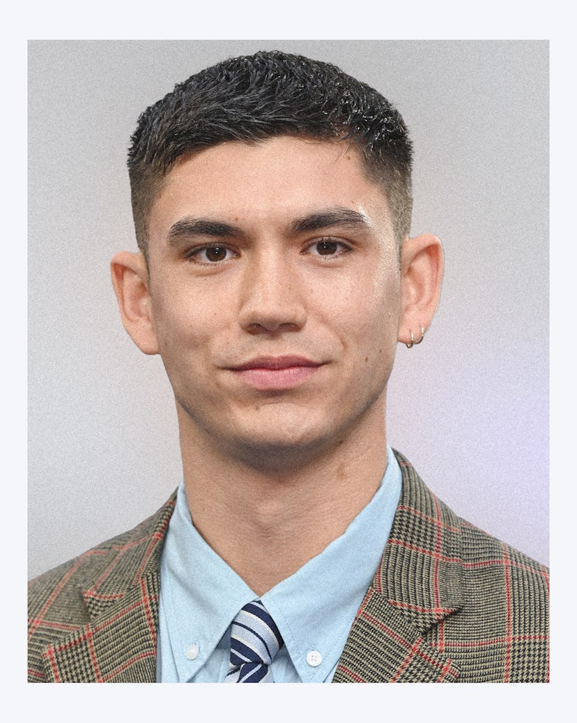 A photo of Archie Renaux wearing a plaid suit