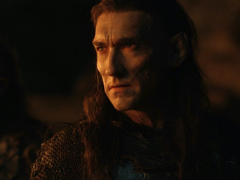 Adar (Joseph Mawle) stands next to an orc in The Lord of the Rings: The Rings of Power Episode 5