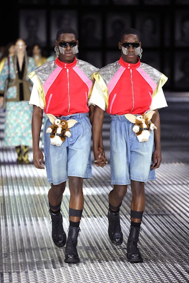 Gucci's Spring 2023 Runway Program Takes Twinning to a New Level 2 Models walk the runway of the Gucci Twinsburg Show during Milan Fashion Week Spring/Summer 2023 on S...