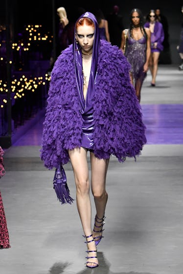 Goths, Bride-to-bes, and Directional Purple 13 A model walks the runway during the Versace Ready to Wear Spring/Summer 2023 fashion show as part of...