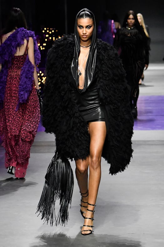 Imaan Hammam walks the runway during the Versace Ready to Wear Spring/Summer 2023 fashion show as pa...