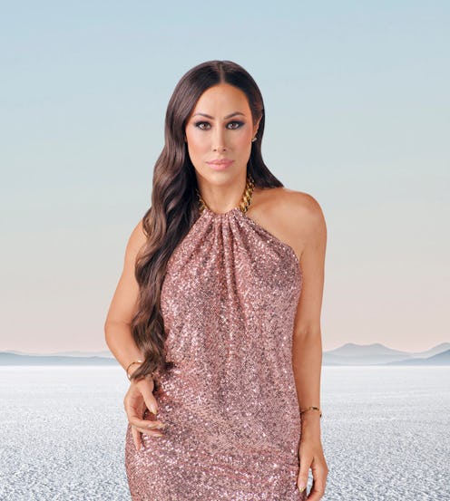 Angie Katsanevas from 'RHOSLC' wearing a glitter dress with the sea in her background