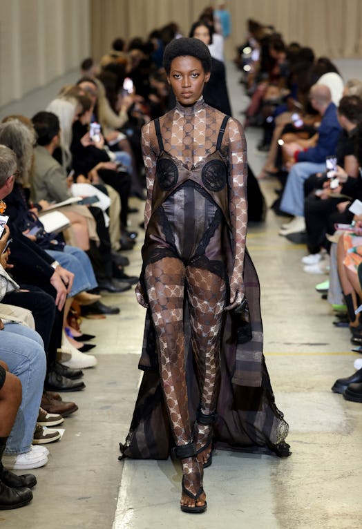 A female model walking the runway at the Burberry show during London Fashion Week September 2022 in ...