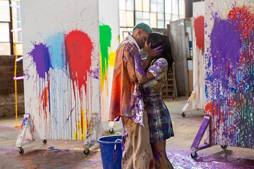 Drea and Russ kissing after a paintball fight