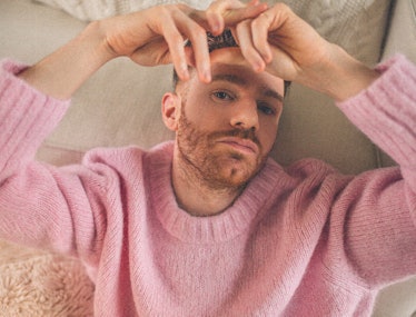 Chris Perfetti wearing a pink wool sweater