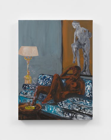 Artist Danielle Mckinney on 'Golden Hour' at Marianne Boesky Gallery 2 A Black woman lying on a printed blue couch, with a lit cigarette on the coffee table in front of he...