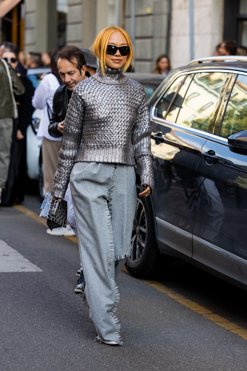 Niki Wu Jie wears silver turtleneck, denim jeans outside Alberta Ferretti during the Milan Fashion W...