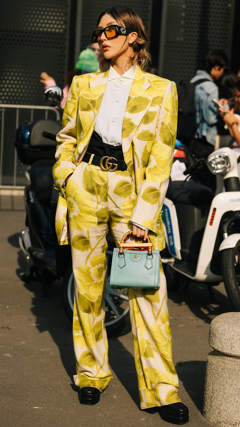 a guest wears a bold suit at milan fashion week