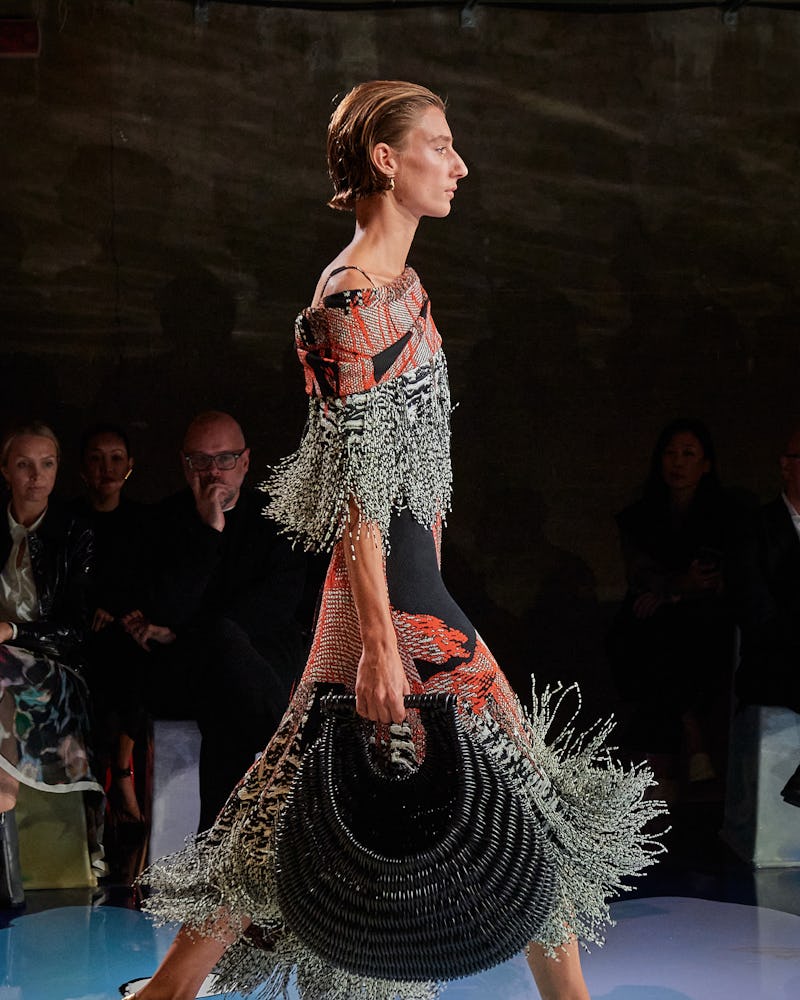 The model wears Bottega Veneta's fringe dress from Spring/Summer 2023 Collection.