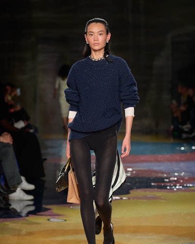 Bottega Veneta's sheer tights paired with a chunky navy-blue knit from Spring/Summer 2023 Collection...