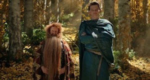Prince Durin IV (Owain Arthur) and Elrond (Robert Aramayo) stand in a forest together in The Lord of...