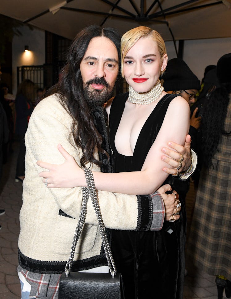 Alessandro Michele and Julia Garner hugging at a Gucci party