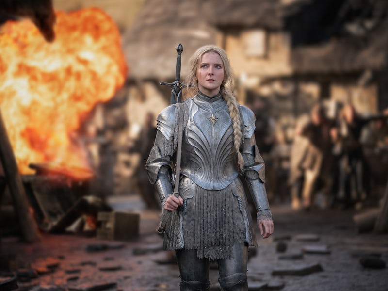 Galadriel (Moryfdd Clark) stands in the middle of a burning village in The Lord of the Rings: The Ri...