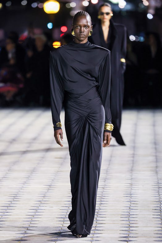  A model walks the runway during the Saint Laurent Womenswear Spring/Summer 2023 show as part of Par...