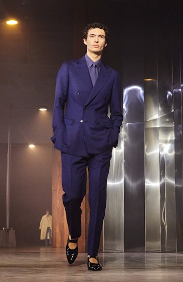 The Reinvented Mary Jane Is All Over on the Spring 2023 Runways 3 A model wearing a navy suit and black Mary Janes