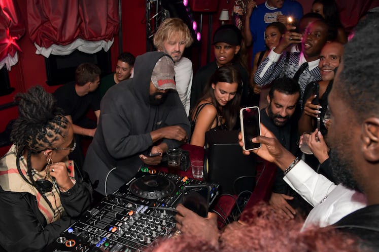 Kanye West DJing at a Burberry party