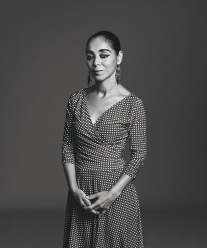 A black and white portrait of Shirin Neshat in her signature eyeliner