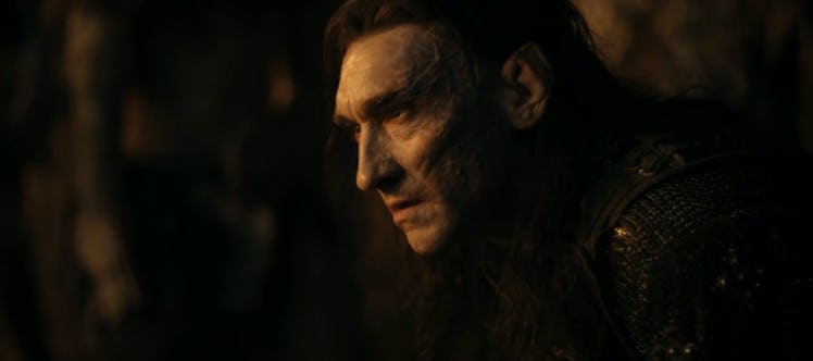 Adar (Joseph Mawle) leans forward in The Lord of the Rings: The Rings of Power Episode 5