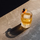 Photo of Old Fashioned Cocktail with a cherry and orange slice