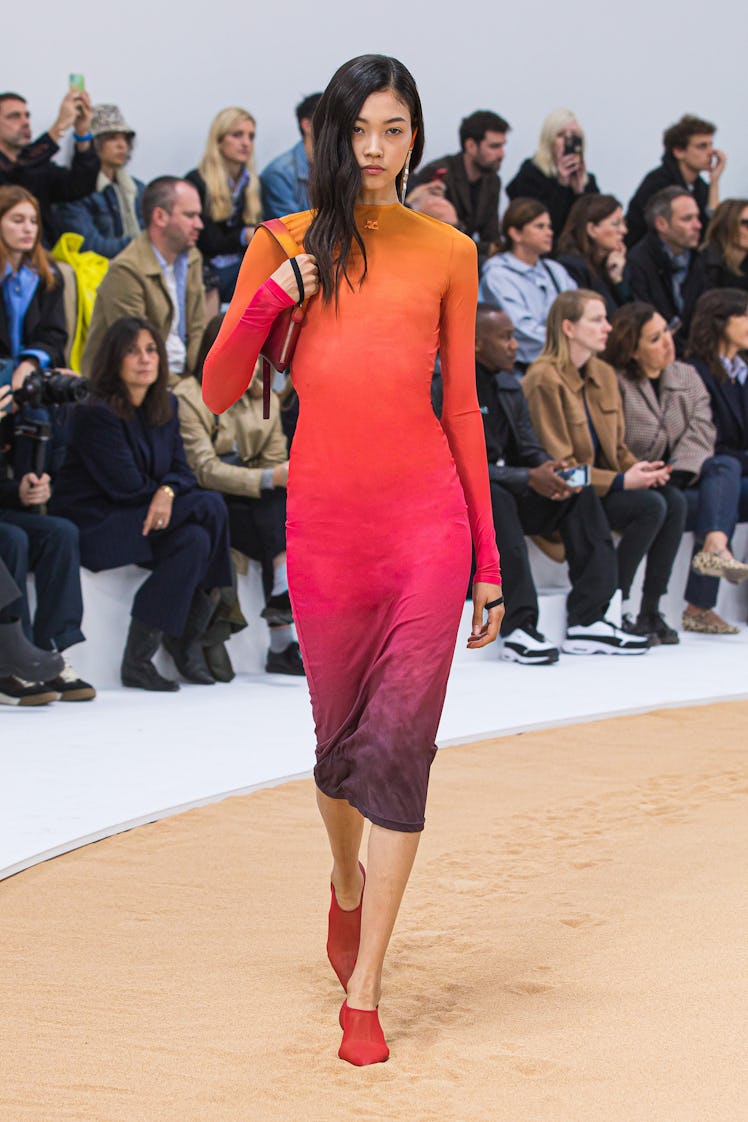 A model wearing Courrèges long-sleeved tight ombre dress at the Paris Fashion Week Spring 2023
