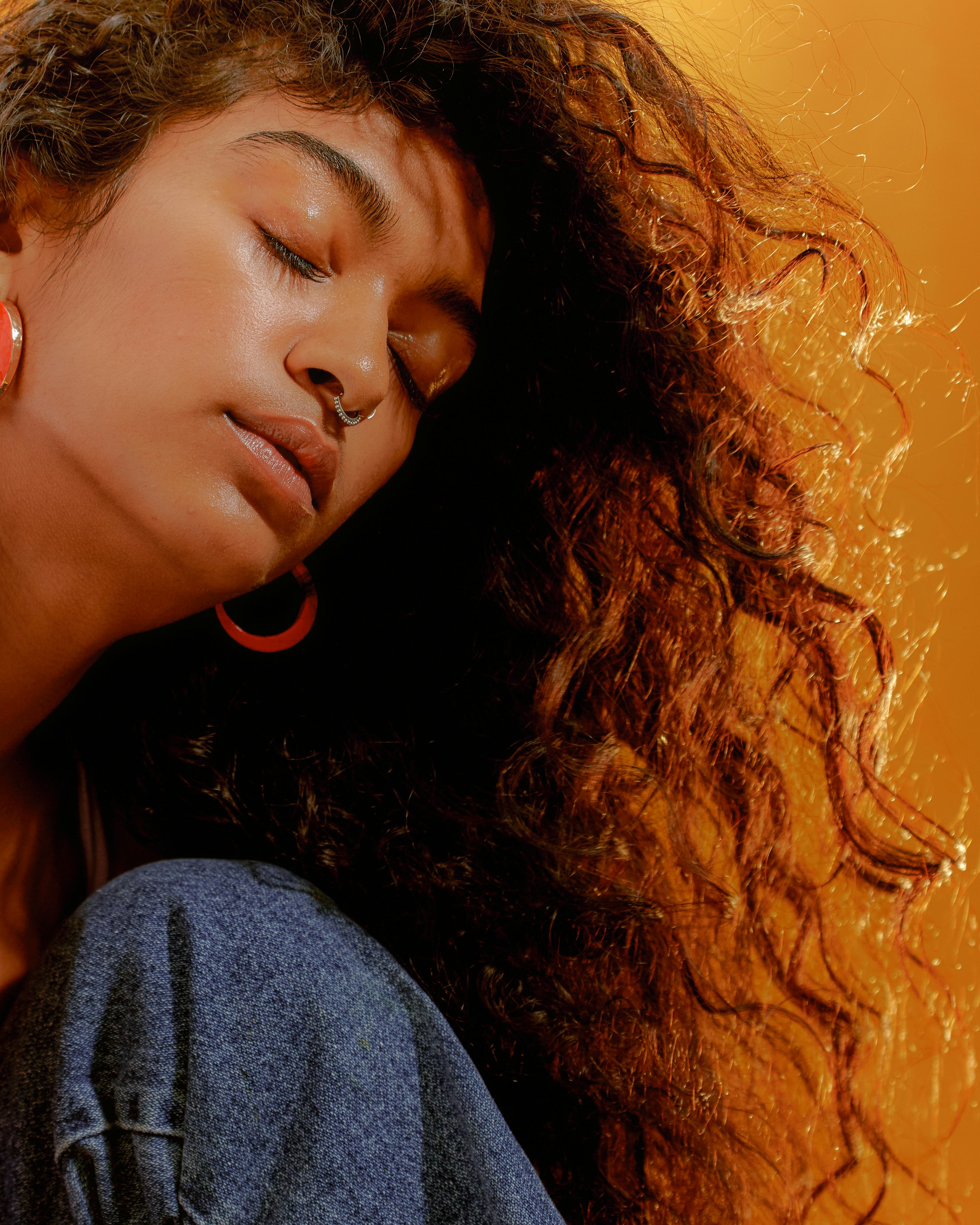 Young woman with her hair blowing in the wind when Mercury retrograde fall 2022 ends on Oct. 2.