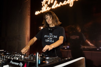 Female DJ mixing at the Lancôme Paris Fashion Week 