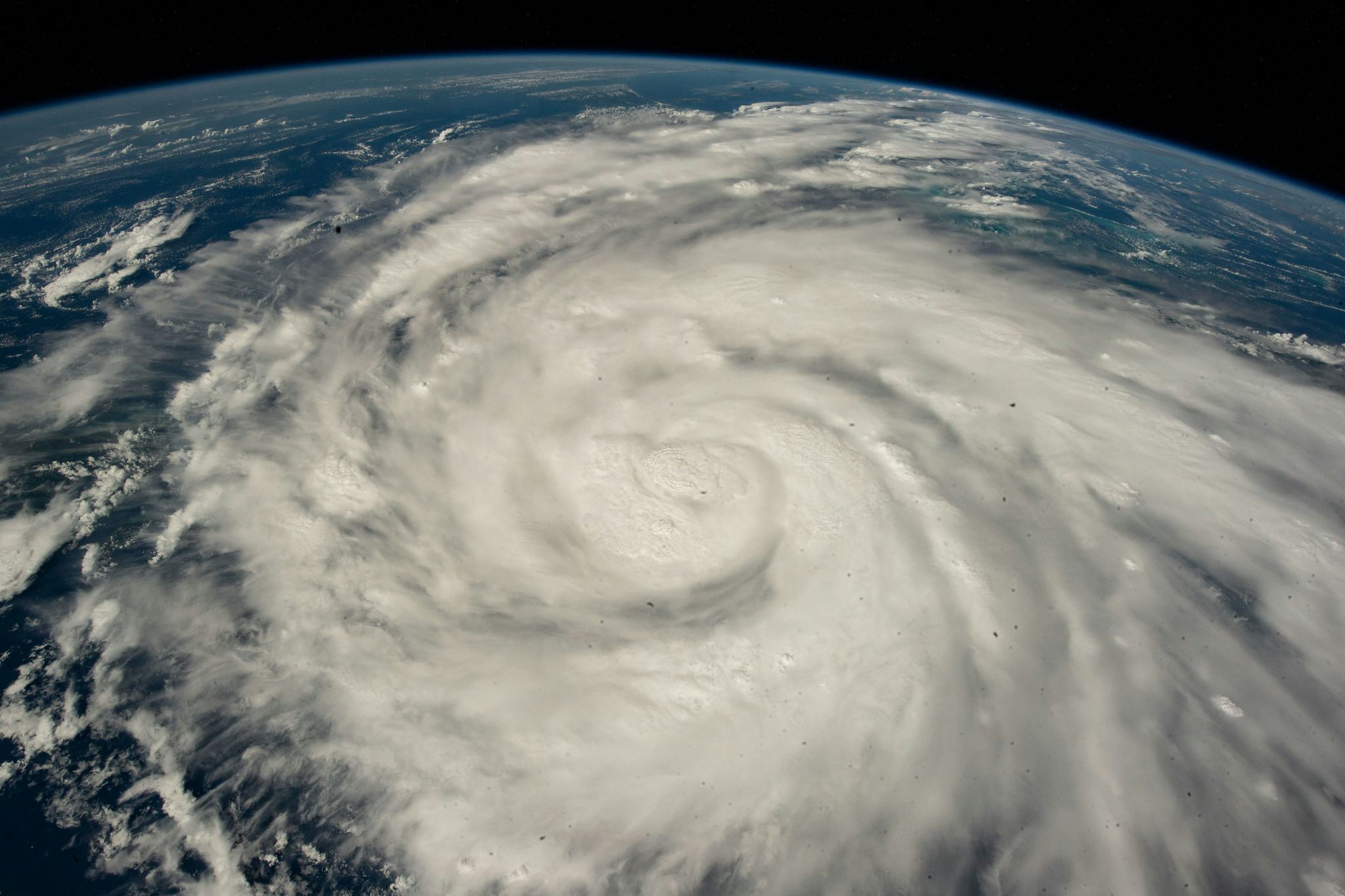 Hurricane Ian, swirled into a spiral, aerial view from the ISS over the Caribbean Sea.