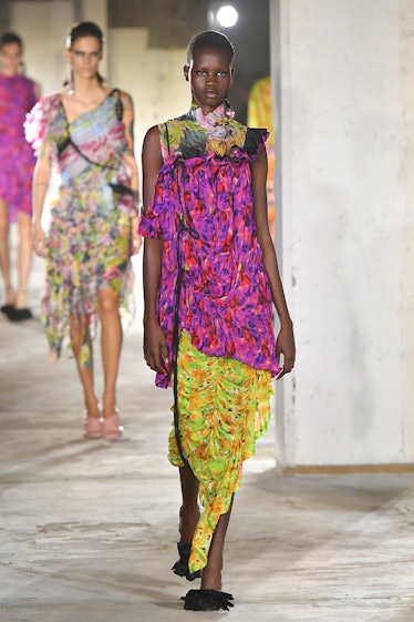 A model in Dries Van Noten’s multicolor top and skirt at Paris Fashion Week, Spring 2023
