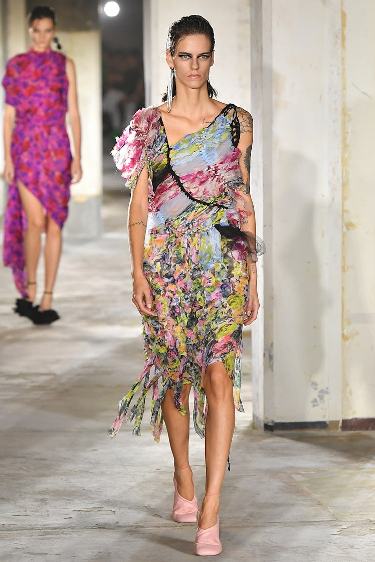 A model wearing Dries Van Noten multicolor cocktail dress at Paris Fashion Week Spring 2023