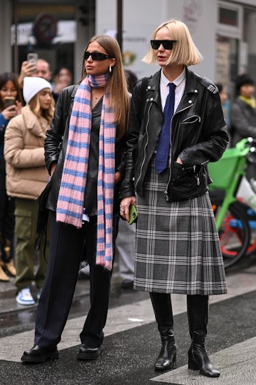 Guests are seen wearing leather jackets, red and blue scarf and a plaid skirt with black sunglasses ...