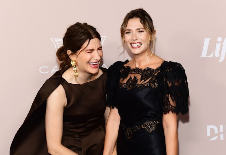 'Wandavision' costars Kathryn Hahn and Elizabeth Olsen laughing on a red carpet