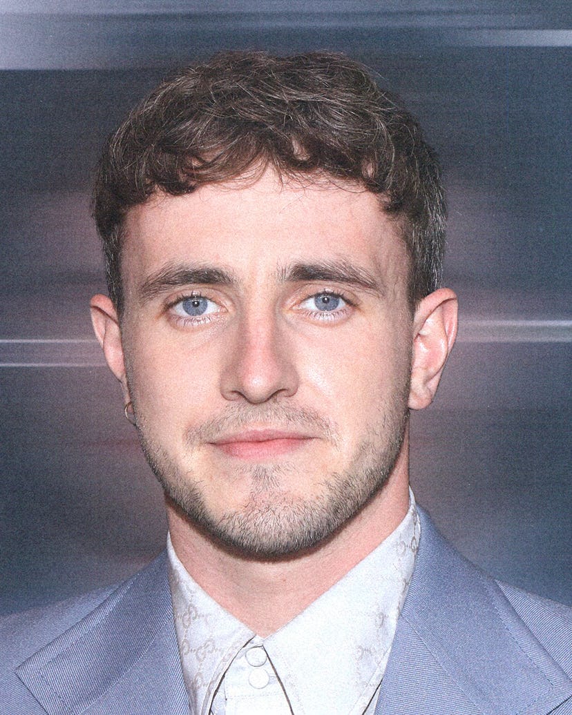 A portrait of Paul wearing a blue suit
