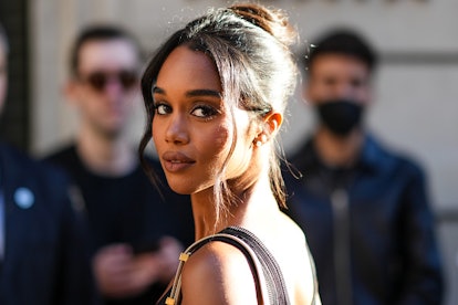Laura Harrier in '90s prom updo hairstyle.