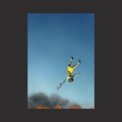 A woman falling down in fire as the cover of Spitfire's new album.