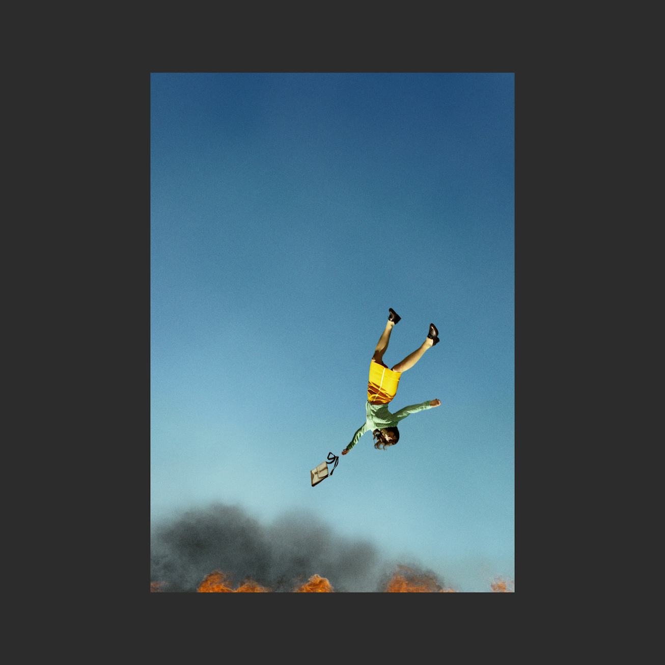 A woman falling down in fire as the cover of Spitfire's new album.