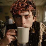 Timothée Chalamet sipping from a coffee cup in 'Bones and All'