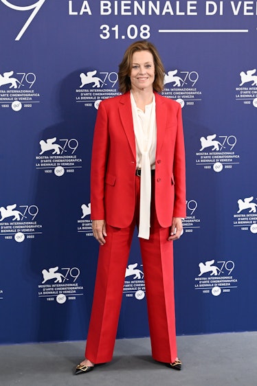 Sigourney Weaver wearing a red suit at the Venice Film Festival