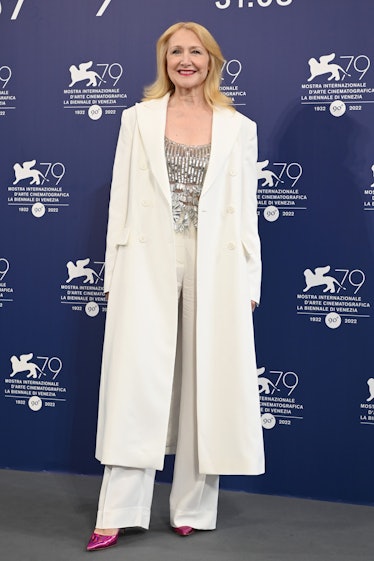 Patricia Clarson wearing a long white coat and silver top at the Venice Film Festival