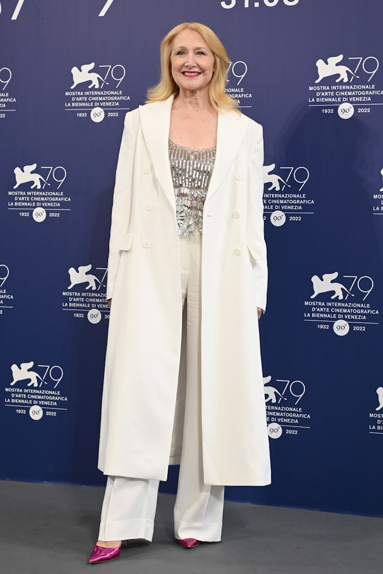 Patricia Clarson wearing a long white coat and silver top at the Venice Film Festival