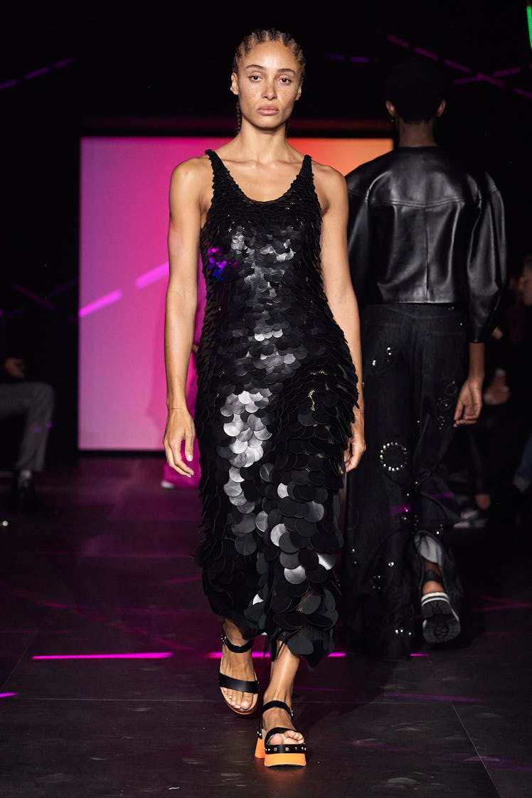 A model wearing Chloé’s black maxi oversize-sequined dress at Paris Fashion Week Spring 2023