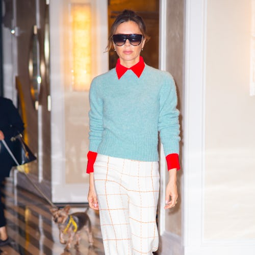Victoria Beckham wearing a sweater and pants