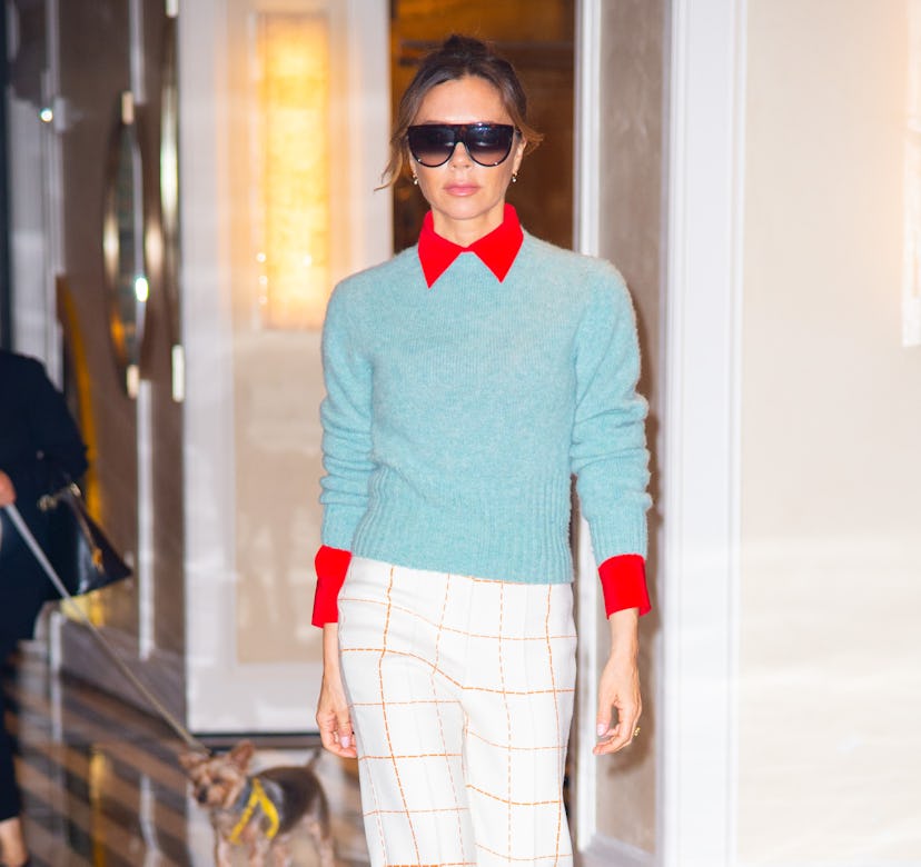 Victoria Beckham wearing a sweater and pants